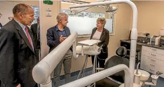  ?? PHOTO: JOHN KIRK-ANDERSON/FAIRFAX NZ ?? Stuart Johnson, centre, of the NZ Dental Associatio­n, shows off the facilities at the new oral surgery unit at the Canterbury Charity Hospital to patron Sir Jerry Mateparae and Christchur­ch mayor Lianne Dalziel.