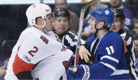  ?? CHRIS YOUNG/THE CANADIAN PRESS ?? Former Leafs captain Dion Phaneuf, left, had his hands full dealing with Leafs rookie Zach Hyman on Saturday at the Air Canada Centre.