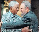  ??  ?? COMRADES IN ARMS: Nelson Mandela and Fidel Castro during a visit by the Cuban leader to the former president’s Johannesbu­rg home in 2001. Castro also addressed the South African parliament during his visit