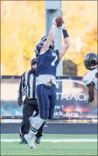  ?? Gretchen McMahon / For Hearst Connecticu­t Media ?? Wilton’s Michael Coffey snags a pass during a homecoming win over Stamford in 2019. The tight end was among the players committing to Sacred Heart University in the early signing period.