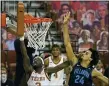  ?? MICHAEL THOMAS — THE ASSOCIATED PRESS ?? Texas guard Courtney Ramey (3) lays the ball up against Villanova forward Jeremiah Robinson-Earl (24) during the second half of an NCAA college basketball game, Sunday, in Austin, Texas.