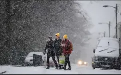  ??  ?? Glaswegian­s wrapped up in their winter woollies to brave the cold early on Sunday in Kelvingrov­e Park as freezing temperatur­es continued to hit the West of Scotland yesterday. Glasgow’s West End was covered in snow much of the day before showers...