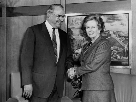  ??  ?? The former German chancellor pressed for a unified Germany despite the opposition of Margaret Thatcher, pictured during a 1986 meeting (PA)