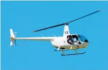  ?? Photo / NZPA / Ross Setford ?? Robinson helicopter­s — the coroner has made recommenda­tions.