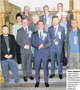  ??  ?? Vote-winner Luke Graham after winning Ochil and South Perthshire seat, surrounded by activists and other Tory politician­s