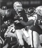  ?? JANE TYSKA/TRIBUNE NEWS SERVICE ?? Oakland Raiders quarterbac­k Connor Cook (8) is sacked by the Seattle Seahawks during the preseason on Sept. 1, 2016.