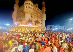  ?? — DC ?? Thousands of devotees offer prayers at the Bhagyalaks­hmi temple near Charminar in Hyderabad on Wednesday midnight.