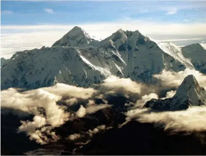  ?? ?? Top of the world: Mount Everest was originally found to be about 29,000ft (8,839.2m) in height