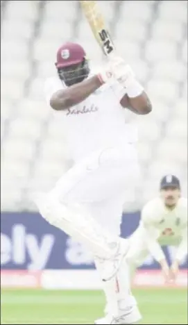  ??  ?? Rahkeem Cornwall gathers runs through the leg side during his brief knock on yesterday’s third day of the third Test.