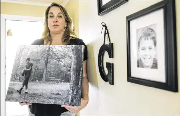  ?? RODOLFO GONZALEZ / AMERICAN-STATESMAN ?? Sherene Mayner, at her home in Austin, holds one of her favorite pictures of her son, Garrett McKinney, who was diagnosed with paranoid schizophre­nia. “He really wished he was not sick,” Mayner said. “He cried a lot about that. He would be sad, and he...