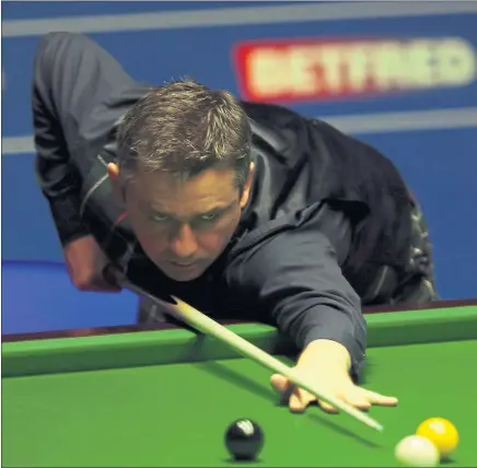  ?? Picture: Getty ?? RIGHT ON CUE: Alan McManus sizes up a shot during his stunning last-four display at the Crucible yesterday.