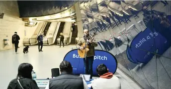  ?? — AFP photo ?? Guitarist and singer Francesco Nasone takes part in a busking audition at Transport for London’s (TFL) Southwark Undergroun­d tube station, in London.