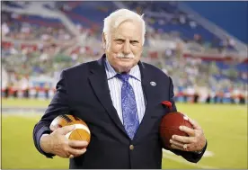  ?? ASSOCIATED PRESS FILE PHOTO ?? Former Florida Atlantic and Miami head coach, Howard Schnellenb­erger holds the game balls prior to the start of the 2014Boca Raton Bowl NCAA college football game between Marshall and Northern Illinois at FAU Stadium in Boca Raton, Fla.