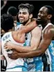  ?? KEVIN C. COX/GETTY ?? Luke Maye is hugged by North Carolina teammates after hitting the winning shot Sunday.