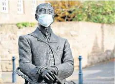  ?? ?? Covered up: Jemma Pearson’s statue of Sir Edward Elgar outside Hereford Cathedral