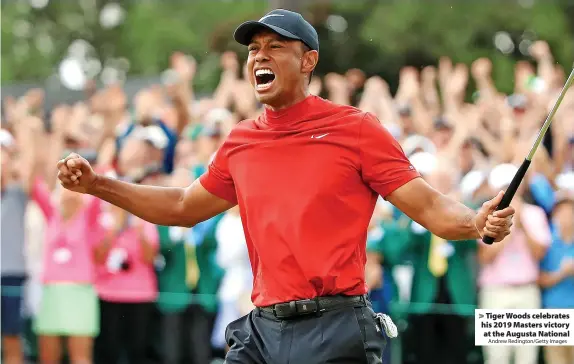  ?? Andrew Redington/Getty Images ?? > Tiger Woods celebrates his 2019 Masters victory at the Augusta National