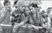  ??  ?? Family members of slain BSF soldier Gurnam Singh mourn near his body at Rathana Morh village.