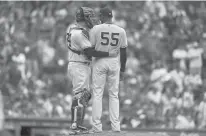  ?? STEVEN SENNE/AP ?? Yankees catcher Gary Sanchez puts an arm around Domingo German after German had his no-hit bid broken up on a double by the Red Sox’s Alex Verdugo in the eighth inning Sunday in Boston.