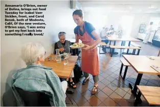  ??  ?? Annamaria O'Brien, owner of Dolina, brings out food Tuesday for Isabel Van-Sickien, front of Modesto, Calif. Of the new venture, O'Brien says, 'I was antsy to get my feet back into something I really loved.'