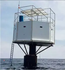  ?? — AFP ?? Sea-cret home: A Royal Thai Navy photo showing the ‘seastead’ home, off Phuket’s shore. The top of the platform serves as a deck, which is covered with solar panels. The ‘home’ is mounted on a 2m-long steel ‘spar’ which is anchored to the ocean’s floor.