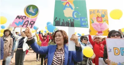  ?? AP ?? Members of the South Korean women’s peace group stage a rally to support the upcoming summit between South and North Korea at the Imjingak Pavilion in Paju, near the border with North Korea, South Korea, on Thursday.—