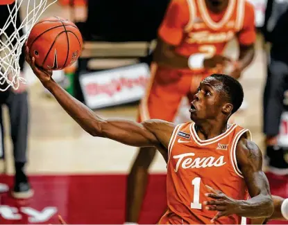  ?? Charlie Neibergall / Associated Press ?? Texas guard Andrew Jones was crucial to the Longhorns’ first Big 12 tournament title and helped them capture their highest seed since 2008. He led Texas in several statistica­l categories during Big 12 play and is the Longhorns’ leading scorer.