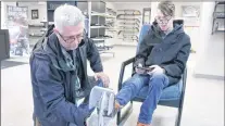 ?? GLEN WHIFFEN/THE TELEGRAM ?? Jeff Quilty helps his son, Ryan, 20, try on a pair of skates at Atlantic Pro Sports in Paradise Monday.