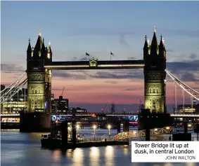  ?? JOHN WALTON ?? Tower Bridge lit up at dusk, in central London