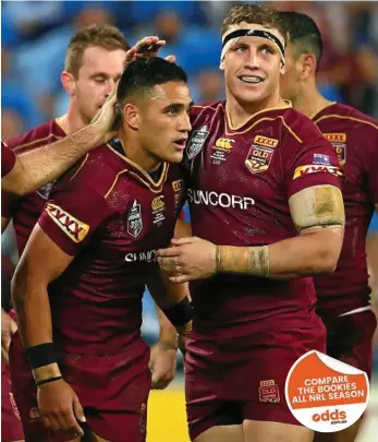  ?? PHOTO: CAMERON SPENCER/GETTY ?? ’JUST A DREAM’: Valentine Holmes (left) is congratula­ted by Maroons teammate Jarrod Wallace after scoring one of his three tries in Origin III.