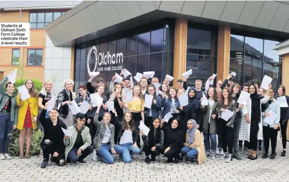  ??  ?? Students at Oldham Sixth Form College celebrate their A-level results