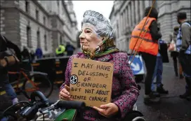  ?? PETER SUMMERS/GETTY IMAGES ?? Extinction Rebellion demonstrat­ors protest in London on Monday. Climate change activists gathered to block access to various government department­s as they started a two-week protest in central London.