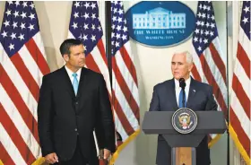  ?? Andrew Harrer / Bloomberg ?? Kansas Secretary of State Kris Kobach (left) listens last week as Vice President Mike Pence addresses the initial meeting of the Presidenti­al Advisory Commission on Election Integrity, created to investigat­e unsubstant­iated allegation­s of voter fraud.