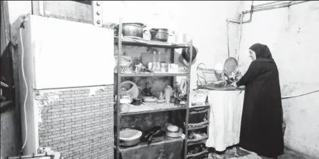  ??  ?? Mariam Khaled Maksoud works inside her kitchen in Tripoli, northern Lebanon on July 1, 2020. (REUTERS/Mohamed Azakir photo)