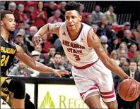  ?? Photo courtesy of Arkansas State ?? Arkansas State University guard Devin Carter (right) decided to stick with the Red Wolves after Grant McCasland was hired as their new coach in March. Now, the senior has a chance to lead the team to a 20-victory season for the first time since 1998.