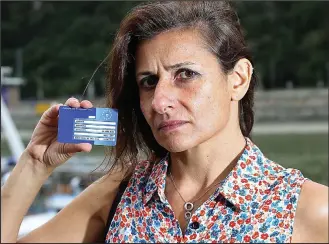  ??  ?? Back in Hungary: Undercover journalist Ani Horvath with her British EHIC card