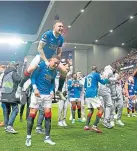  ?? ?? James Tavernier and Scott Arfield celebrate after their win.