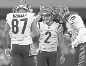  ?? KAREEM ELGAZZAR/THE ENQUIRER ?? Bengals kicker Evan Mcpherson (2) is congratula­ted after kicking a 54-yard field goal in the first quarter during a NFL Week 11 game against the Raiders last Sunday at Allegiant Stadium in Las Vegas.