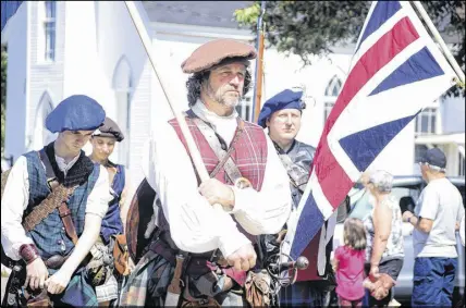  ?? FRAM DINSHAW/ TRURO NEWS ?? Members of the local Gallus Gael living history group marched in the Debert Days Parade wearing full historical regalia, including tartan kilts similar to those worn by Highlander rebels at the Battle of Culloden in Scotland three centuries ago. One member even brought a musket to the parade on Aug. 11.