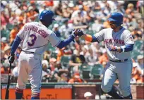  ?? Associated Press ?? New York Mets’ Rene Rivera, right, is met at the plate by teammate Curtis Granderson after hitting a solo home run against the San Francisco Giants during Sunday’s game in San Francisco.