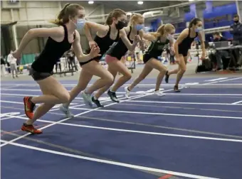  ?? PAUL CONNORS pHOTOS / BOSTON HERALD ?? ON YOUR MARK, GET SET ... Runners leave the starting line during the 1,000-meter race at the Bay State Running Invitation­al yesterday at Wheaton College.