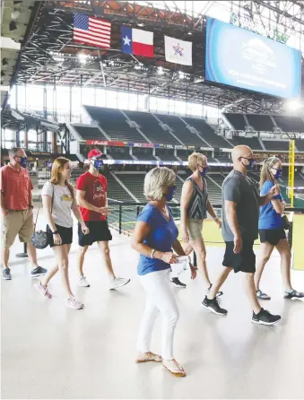  ?? TIM HEITMAN/USA TODAY SPORTS ?? Fans tour Globe Life Field, the shiny new home of the Texas Rangers built with at least US$500 million of taxpayers’ money, back on June 1.