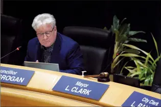  ?? NEWS PHOTO COLLIN GALLANT ?? Coun. Andy McGrogan sits beside the empty mayor’s chair as he reads a letter of reprimand issued to Mayor Linnsie Clark at a special meeting of city council on Thursday.