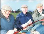  ?? ?? L-r: James Murphy, along with John Sheehan (Ballynoe) and Patsy Lane (Conna) planning their next move at the point-to-points in Dromahane in 2002.