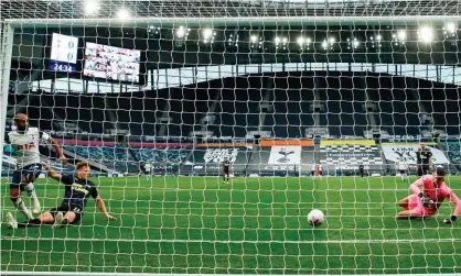  ??  ?? Lucas Moura slides the ball home to give Tottenham a first-half lead. Photograph: Andrew Boyers/AFP/Getty Images