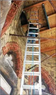  ?? SUBMITTED PHOTO — SCHUYLKILL CENTER ?? State peregrine coordinato­r Art McMorris climbs just one ofmany ladders to get to the top of the steeple.