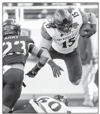  ?? AP/Fort Worth Star-Telegram/STEVE NURENBERG ?? San Diego State fullback Nick Bawden (15) dives for yardage during Saturday’s Armed Forces Bowl against Army at Fort Worth.