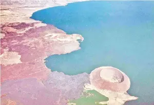  ?? — AFP photo ?? An aerial image shows a part of Nabiyotum Crater in Lake Turkana, the world’s largest desert lake, in northern Kenya. A Unesco panel added Lake Turkana, a conservati­on hotspot in Kenya and a candidate site for the birthplace of mankind, to the list of endangered World Heritage Sites.