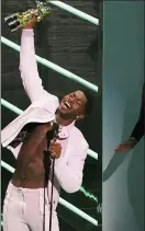 ??  ?? Lil Nas X accepts the award for video of the year for “Montero (Call Me By Your Name)” at the MTV Video Music Awards at Barclays Center on Sunday in New York.