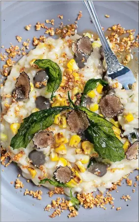  ?? DEB LINDSEY/THE WASHINGTON POST ?? Corn risotto with truffles, huitlacoch­e and popcorn