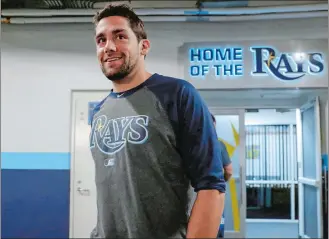  ?? MIKE CARLSON/AP PHOTO ?? Nathan Eovaldi emerges from the Tampa Bay clubhouse for a press interview after being traded to the Red Sox prior to Wednesday’s game against the Yankees at St. Petersburg, Fla.